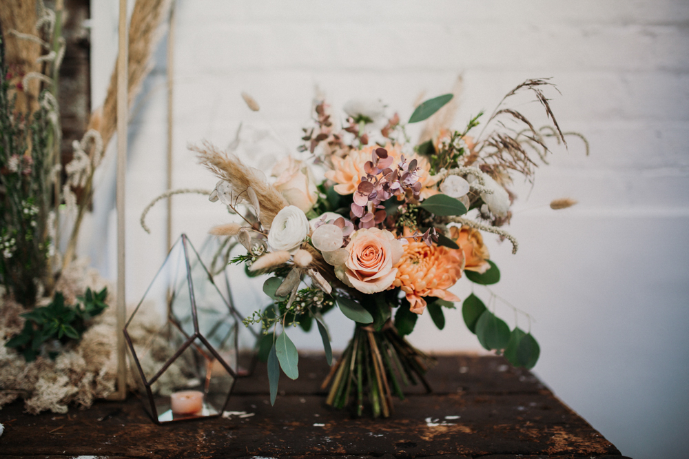 Boho Woodland Wedding with Black Wedding Cake and Autumnal Flowers