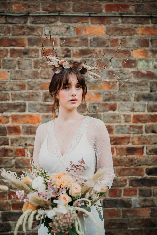 Boho Woodland Wedding with Black Wedding Cake and Autumnal Flowers