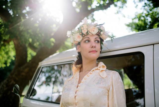 1970s vintage wedding boho bride with camper van and flower crown photo by Binky Nixon for the National Vintage Wedding Fair