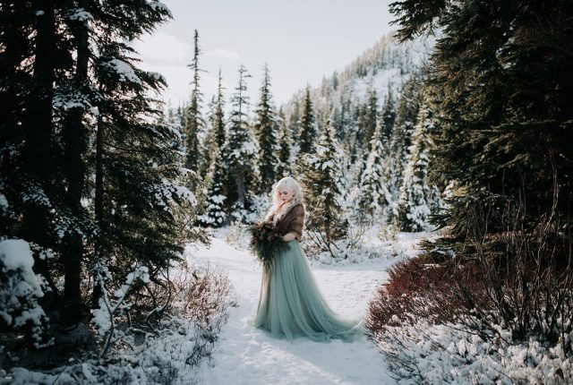 Winter Wonderland Wedding with Blue Wedding Dress and Fur Capelet