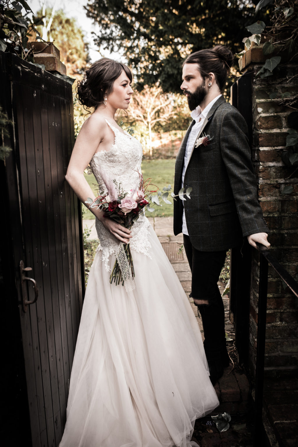 Classic Rock Wedding with Black Wedding Cake and Alternative Groom Style