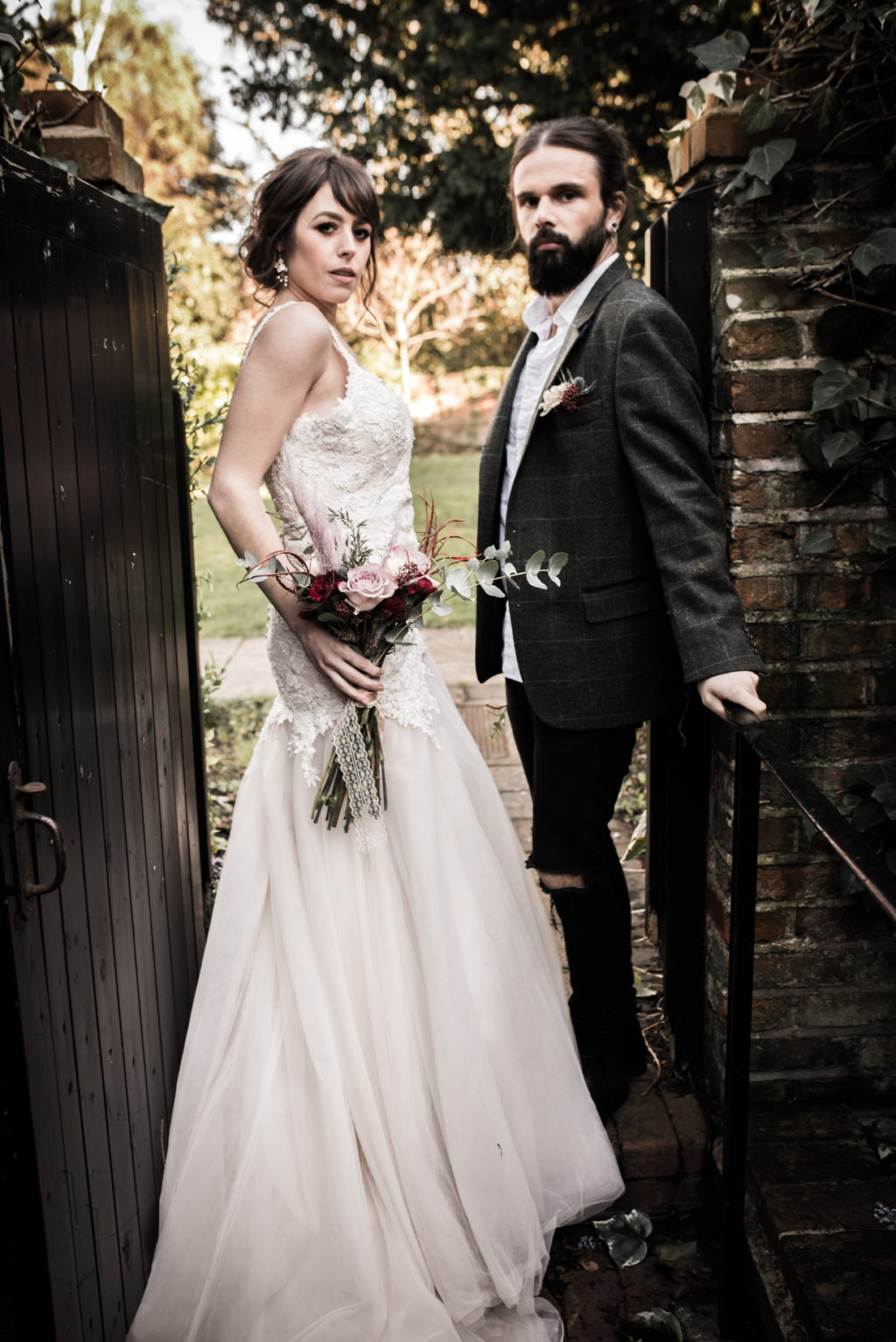 Classic Rock Wedding with Black Wedding Cake and Alternative Groom Style