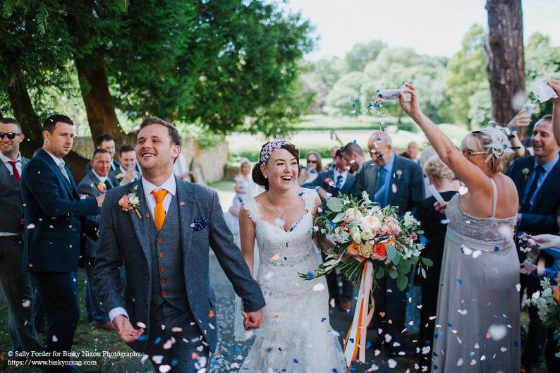 Bride and Groom Being Showered In Biodegradable Blush Grey & Ivory Wedding Confetti 