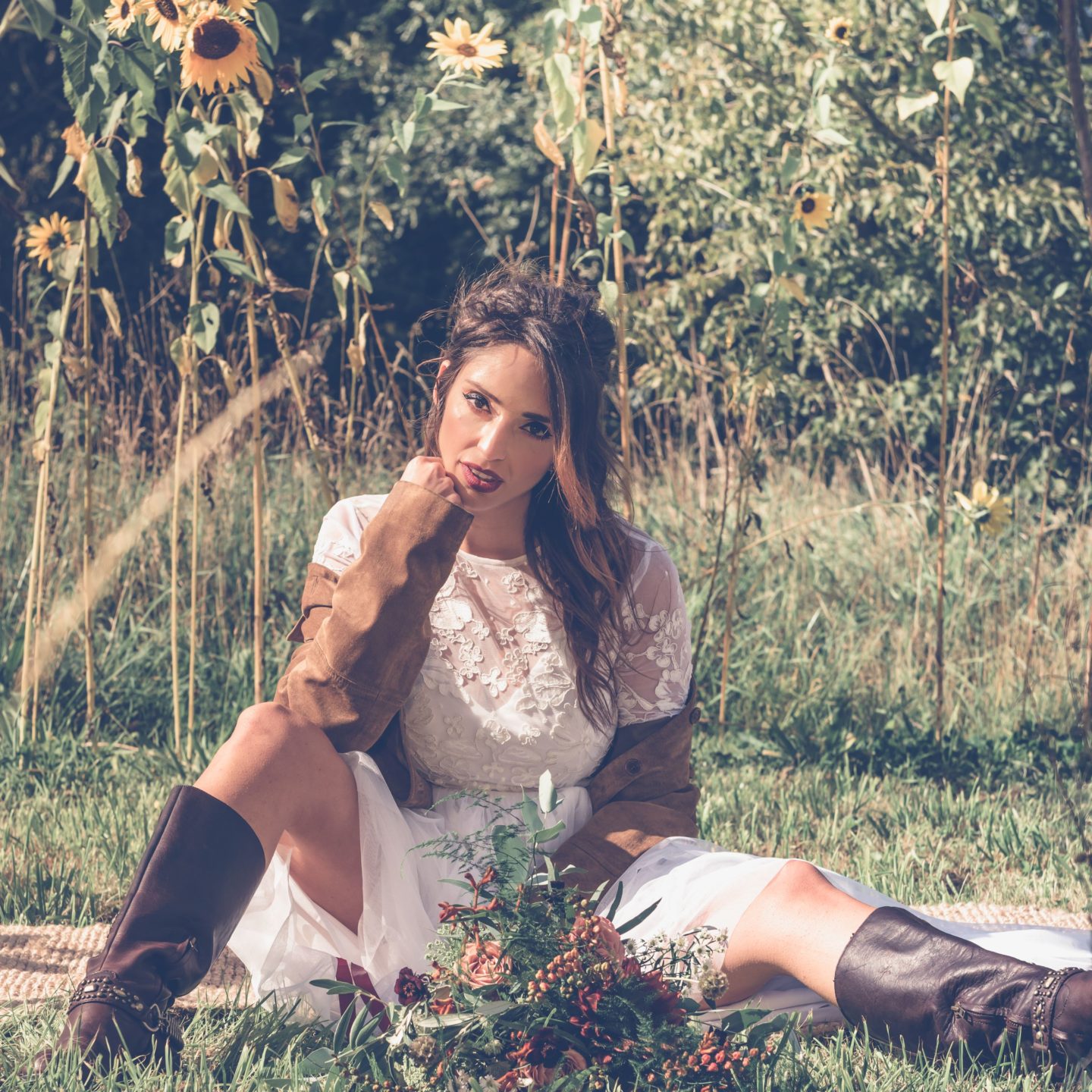 1970s Bohemian Bridal Inspiration With Field Flower Bouquets Cowboy Boots and Suede Jackets 