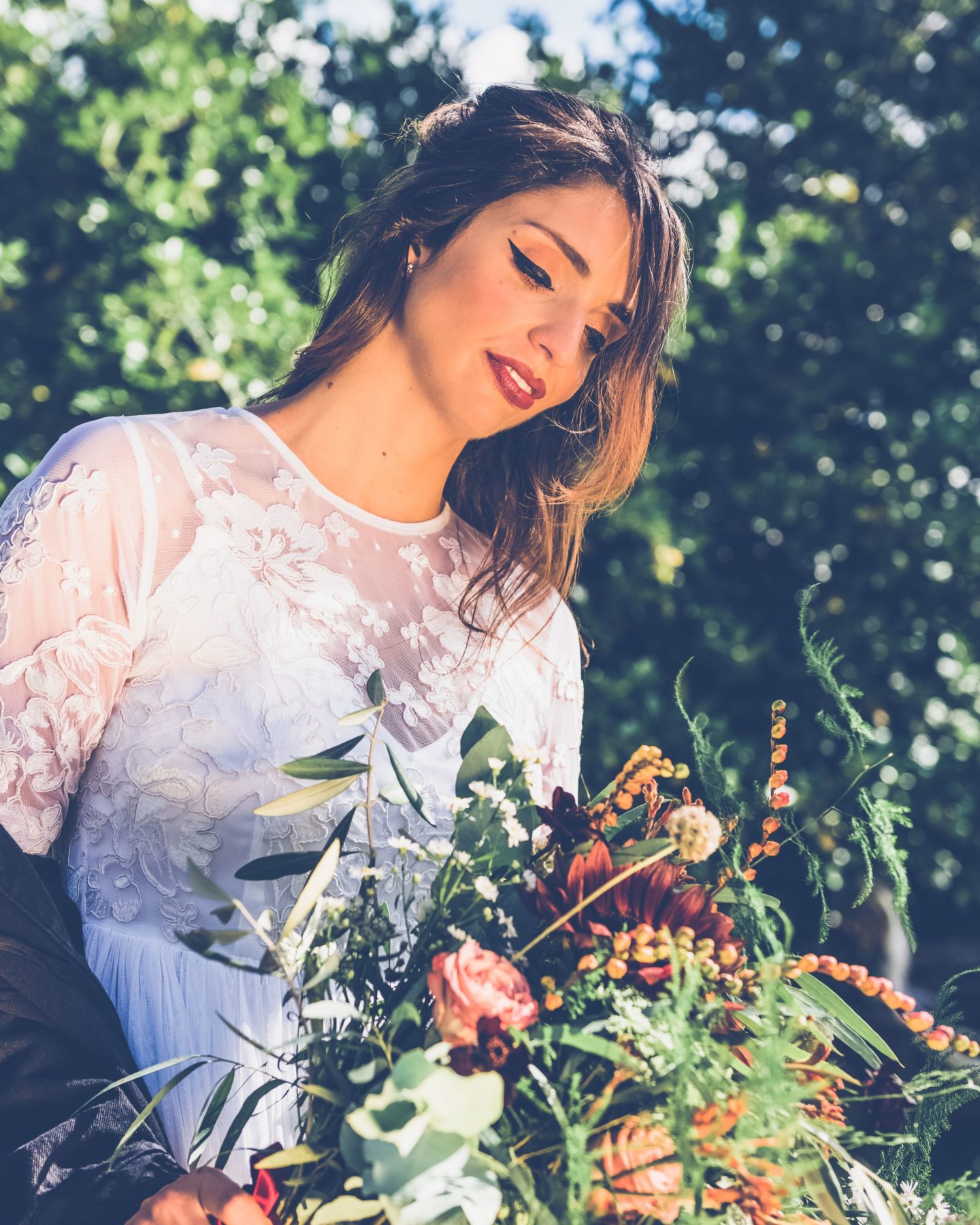 1970s Bohemian Bridal Inspiration With Field Flower Bouquets Cowboy Boots and Suede Jackets 