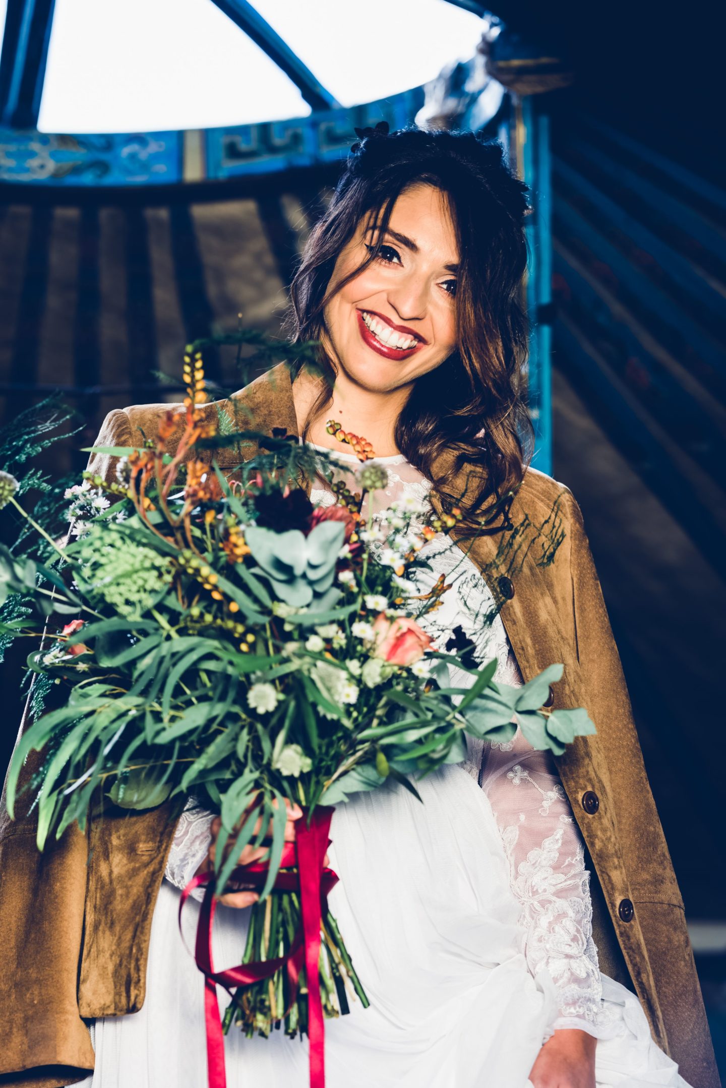 1970s Bohemian Bridal Inspiration With Field Flower Bouquets Cowboy Boots and Suede Jackets 