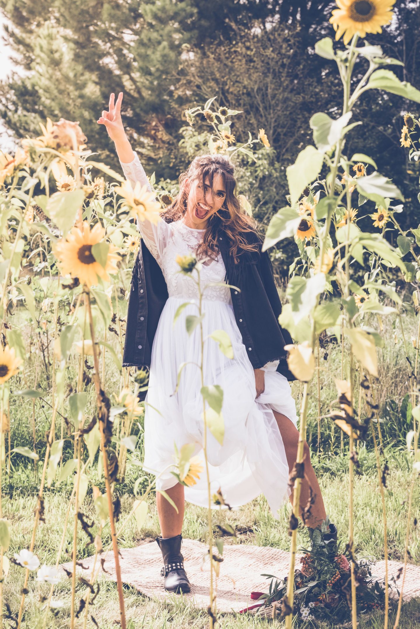 1970s Bohemian Bridal Inspiration With Field Flower Bouquets Cowboy Boots and Suede Jackets 