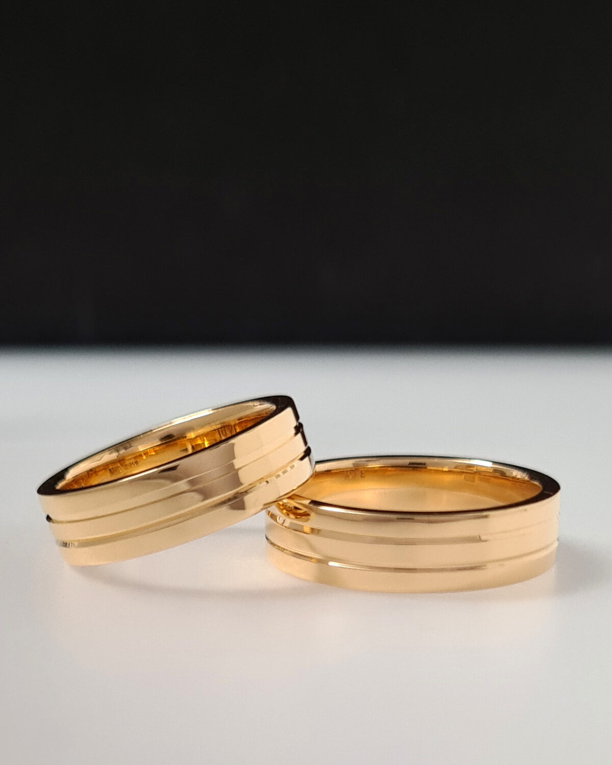 Wedding rings with groove details in 22k recycled gold.