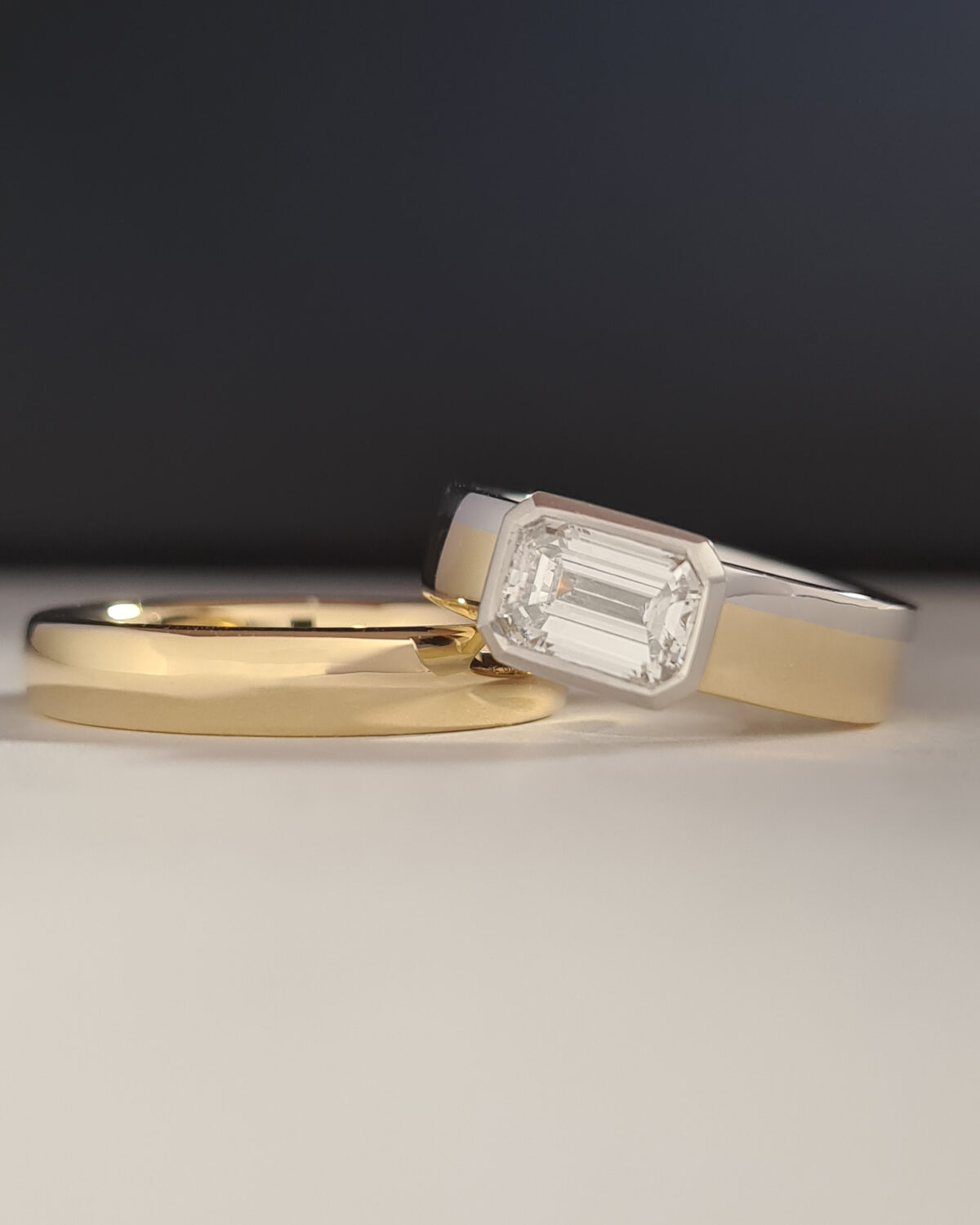 Bespoke wedding rings reusing the client's diamonds, gold and platinum.