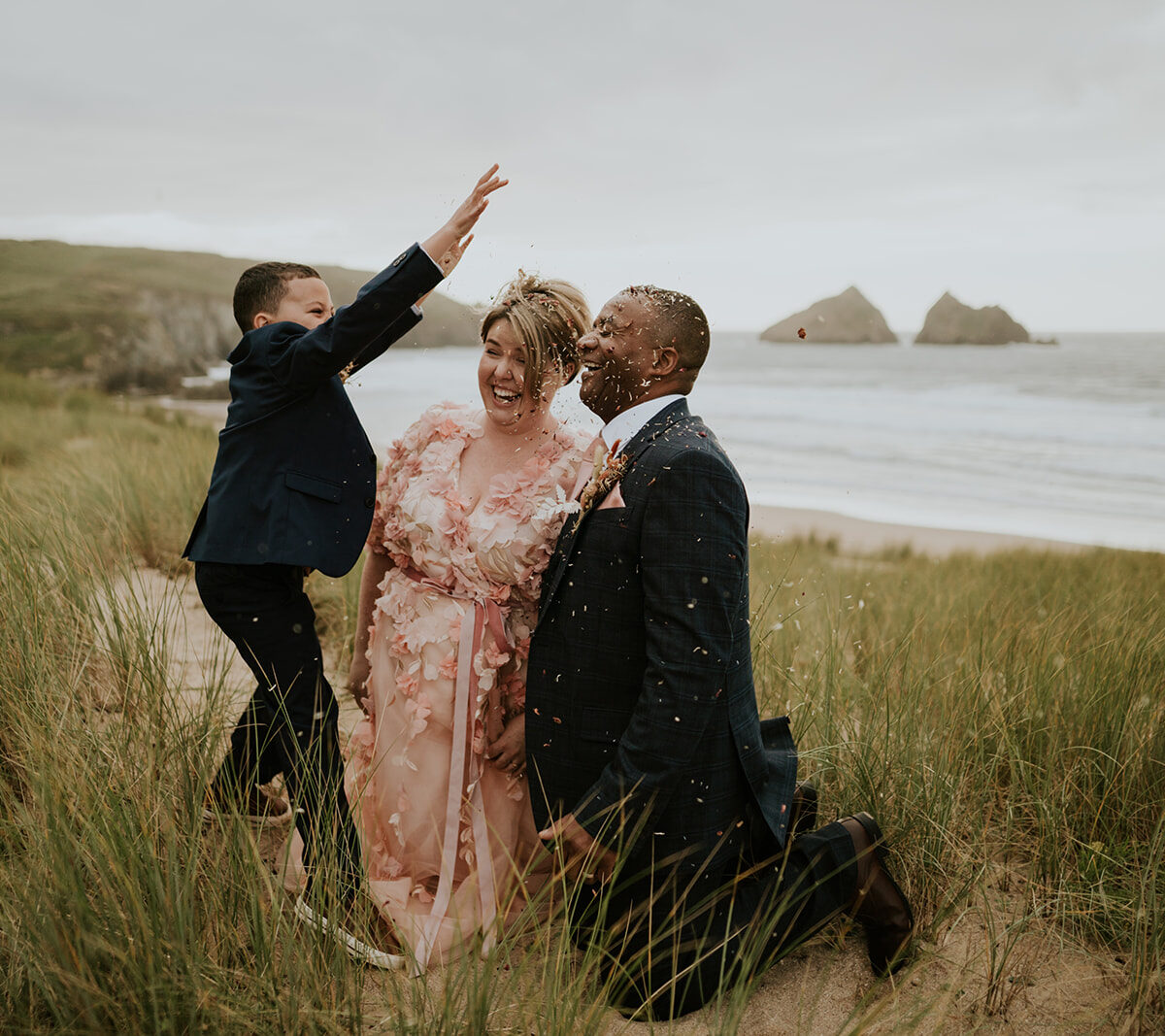 Family fun - throwing confetti in the Cornish sand dunes