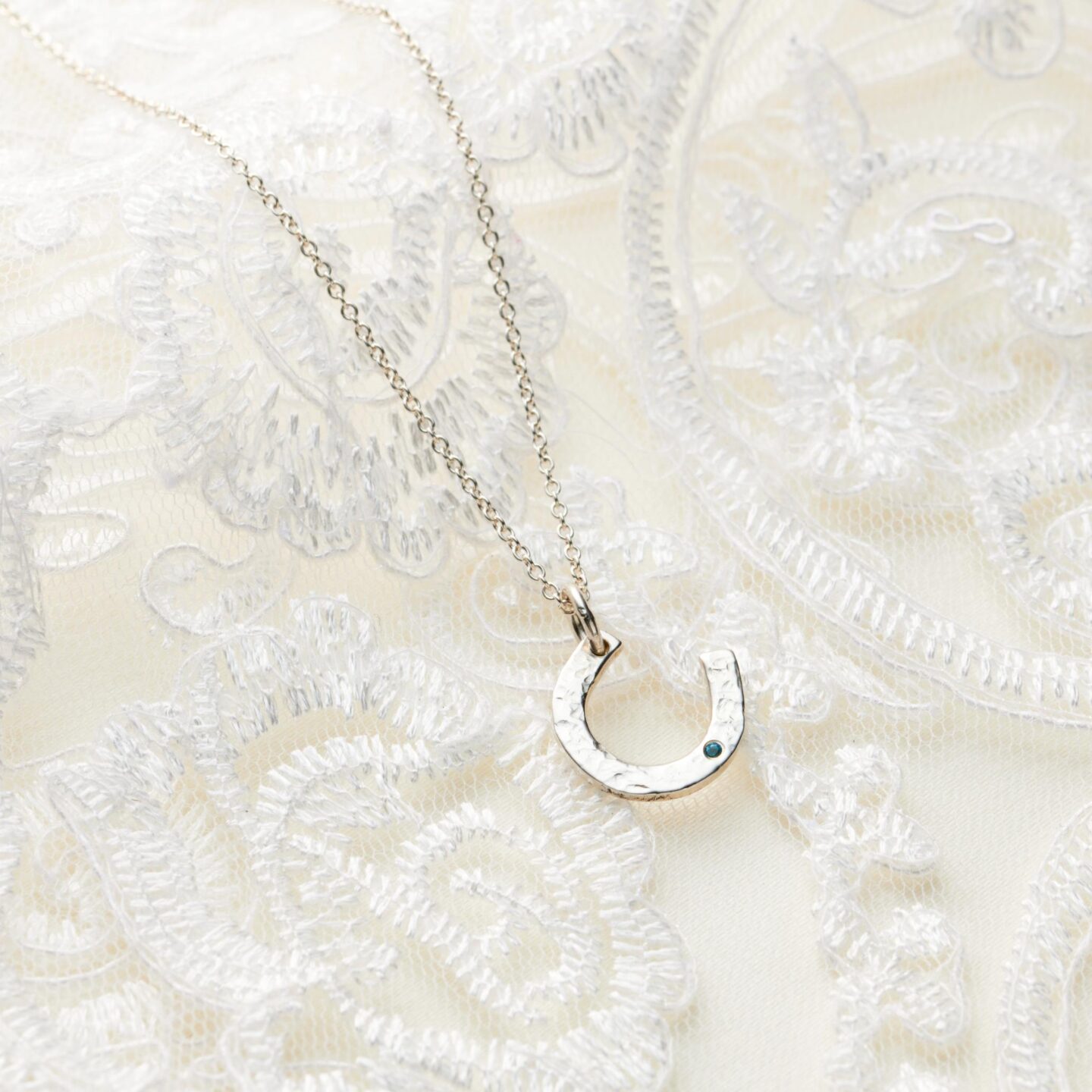 Silver and sapphire birthstone horseshoe necklace